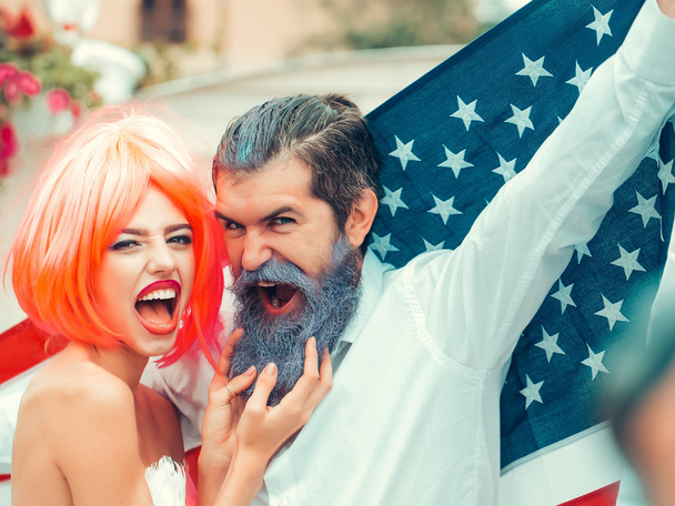 Happy young patriotic American couple bright make up and hair celebrating Independence Day on 4th of July - Fotoğraf, Görsel