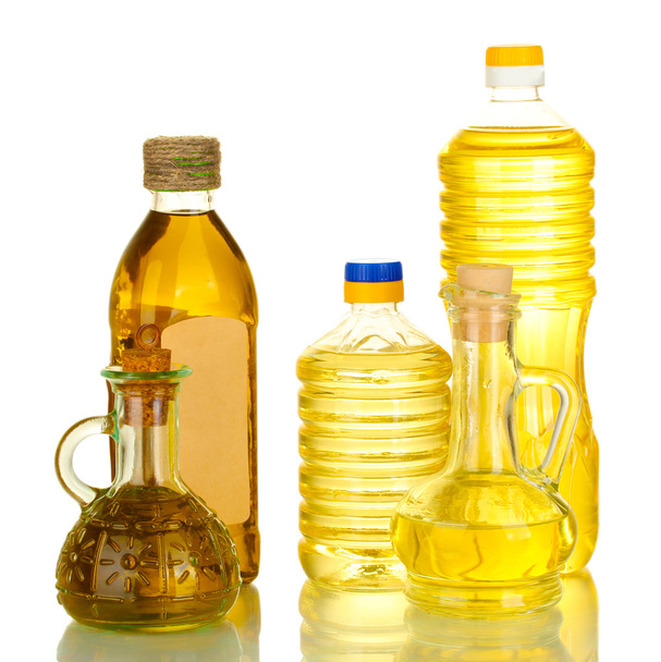 Aceite de oliva y girasol en las botellas y pequeños decantadores aislados en blanco
 - Foto, Imagen