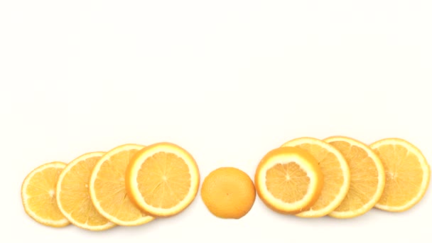  orange slices moving  white background - Video, Çekim