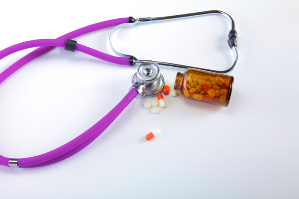 medical stethoscope with pills isolated on white background - Photo, Image