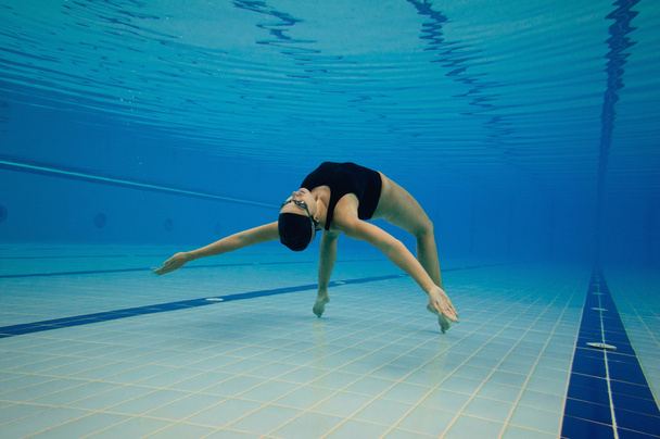swimmer performing figure - Photo, Image