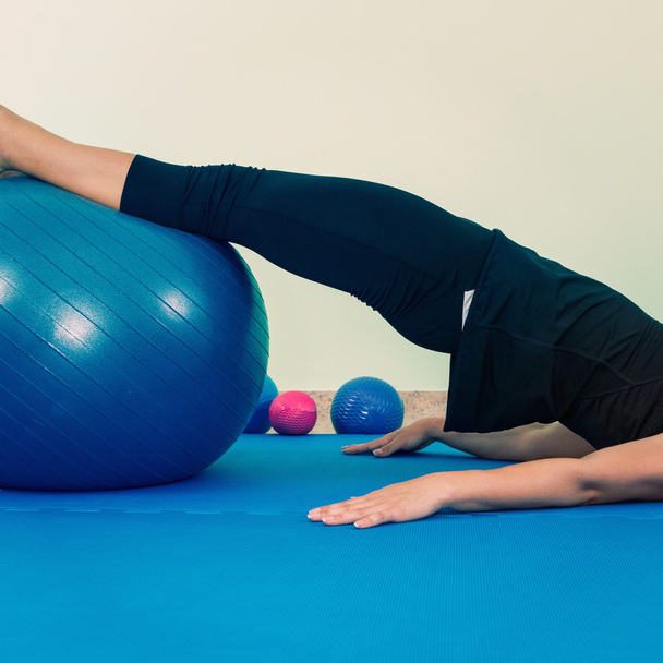 Exercising with fitness ball - 写真・画像