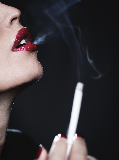 Concept photo of a woman smoking a cigarette. - Fotoğraf, Görsel