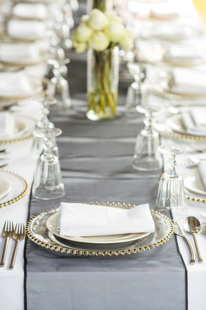 Elegance table set up with lotus flowers, selective focus. - Foto, Imagen