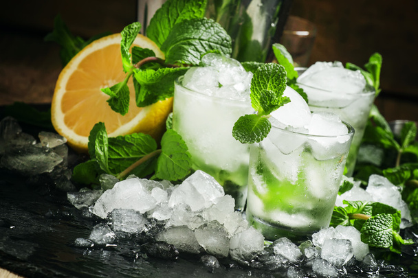 Cocktail with mint, lemon and crushed ice - Fotó, kép