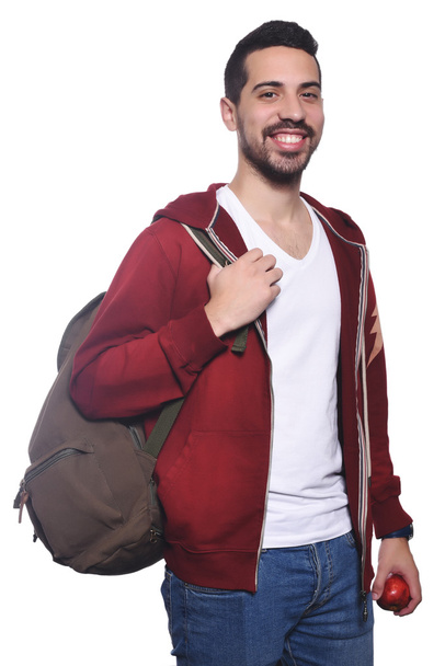 Portrait of young latin student with an apple and backpack . - Φωτογραφία, εικόνα