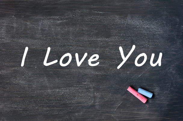 I love you - written with chalk on a Smudged blackboard background - Foto, afbeelding