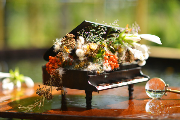 Souvenir piano. Flower Arrangement in piano. - Photo, Image