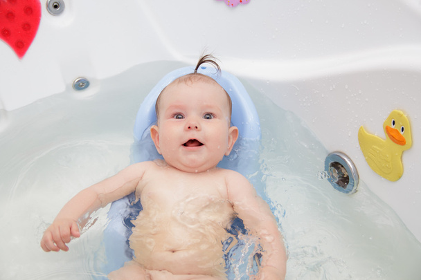 Newborn baby bathe and swim - Foto, imagen