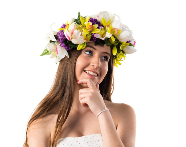 Girl with crown of flowers thinking - Foto, Imagen