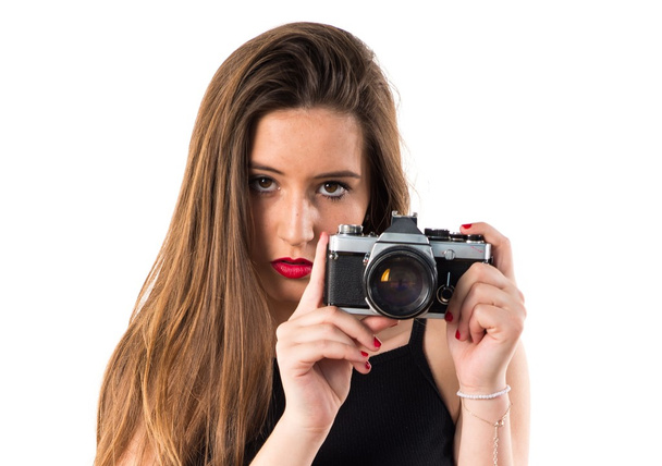Молода дівчина тримає камеру
 - Фото, зображення