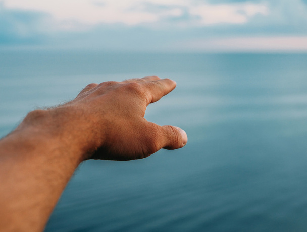 Pointing into the sea distance  - Valokuva, kuva