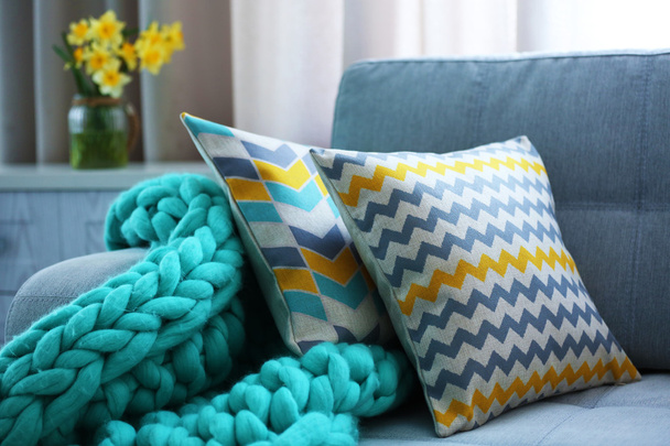 Stylish pillows on couch - Zdjęcie, obraz