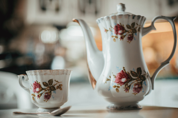 Beautiful vintage tea-service on a kitchen table. - Fotó, kép
