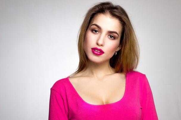 girl with pink lips in studio - Фото, изображение