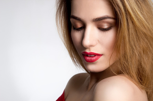 girl with red lips in studio - Фото, изображение