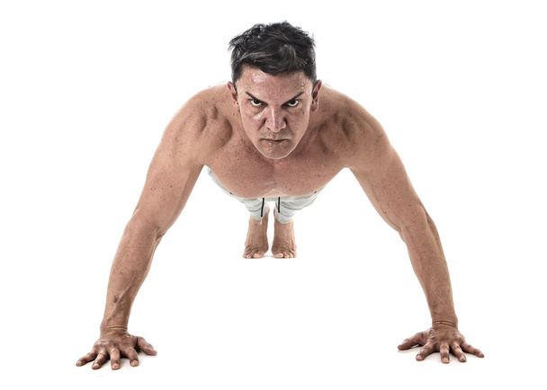 40 to 45 years old fit man doing push up workout training fitness routine with strong muscular body  - Foto, afbeelding