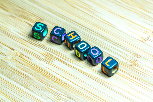 Colorful letter cube with bamboo texture surface. Educational co - Photo, Image