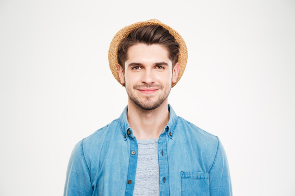 Happy relaxed young man in hat and blue shirt - Foto, Imagen