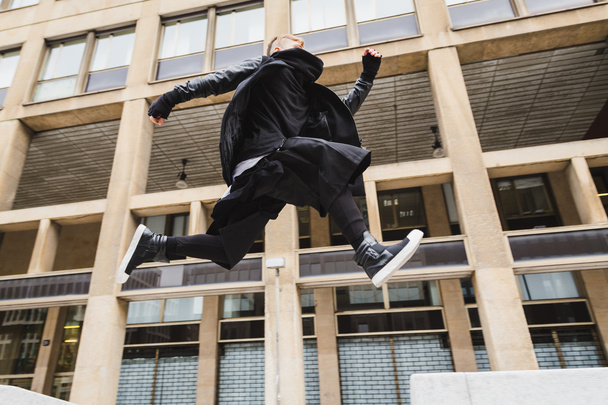 Stylish bearded man jumping in the street - Zdjęcie, obraz