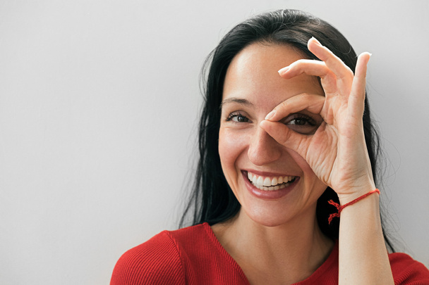 Laughing woman making ok gesture with hand - Fotoğraf, Görsel