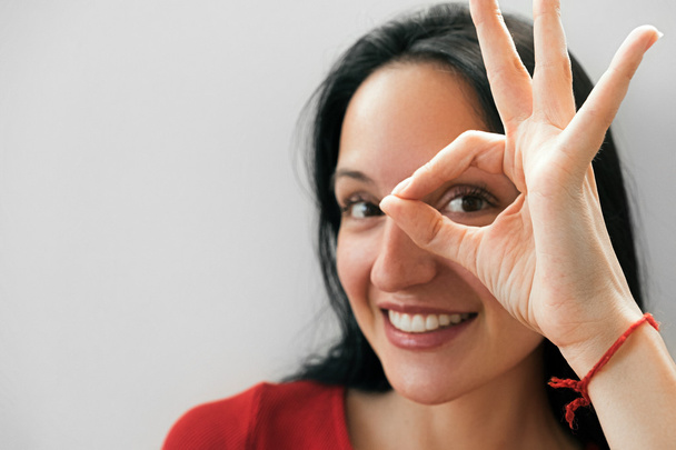 Smiling woman making ok hand gesture - Photo, image