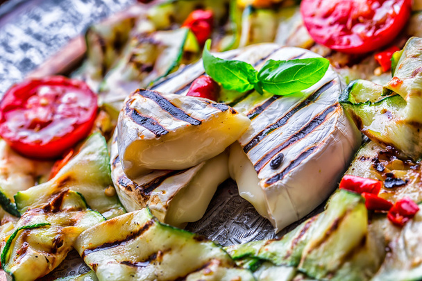 Grill Brie camembert cheese zucchini with chili pepper and olive oil. Italian mediterranean or greek cuisine. Vegan vegetarian  food. - Foto, imagen