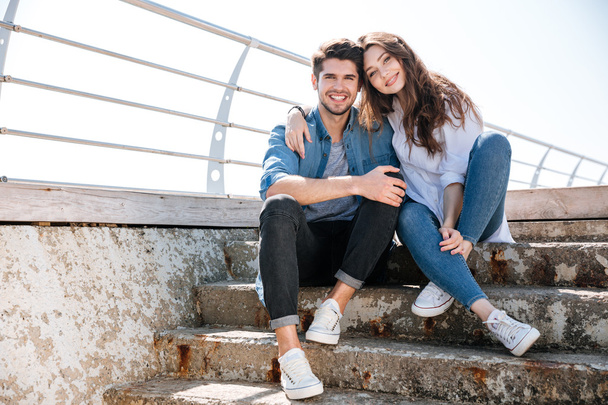 Portrait of a smiling happy young couple looking at camera - Foto, Imagem