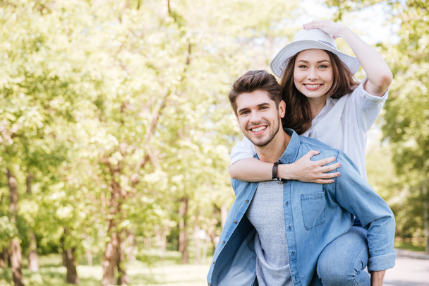 Portrait of a happy young couple having fun outdoors - Фото, изображение
