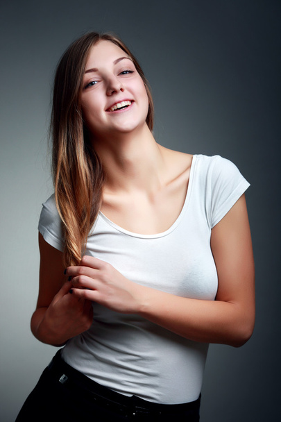 A Studio Portrait Of Smiling Teenage Girl - Φωτογραφία, εικόνα