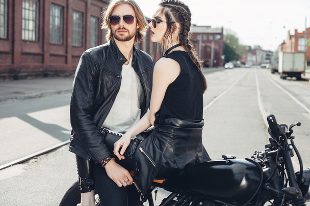 Couple in love and vintage custom motorcycle - Fotó, kép