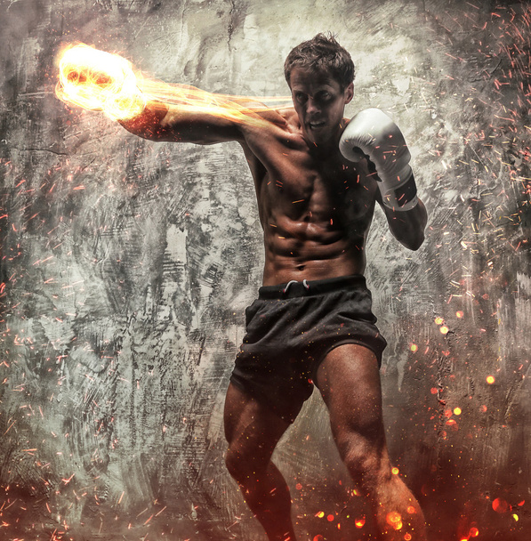 lutador em faíscas de fogo e fumaça
 - Foto, Imagem