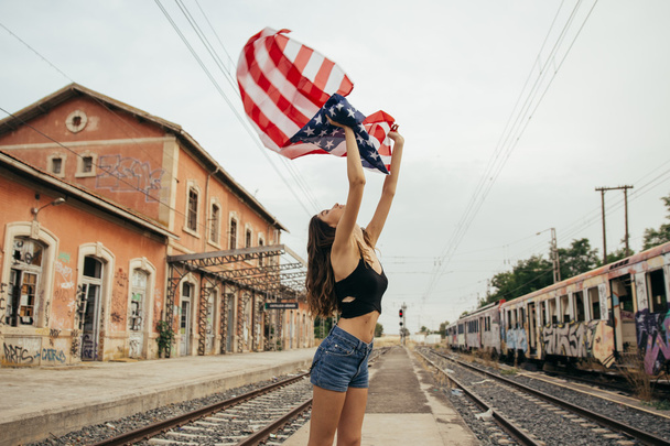 Girl with american flag  - Фото, изображение