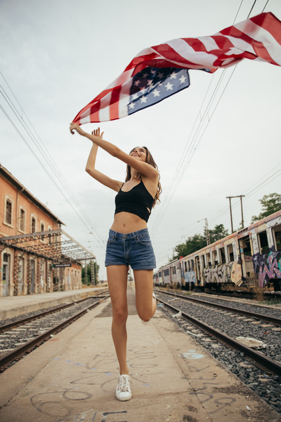 Girl with american flag  - 写真・画像