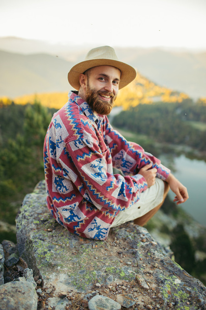 Man on hat smiling in nature  - Φωτογραφία, εικόνα