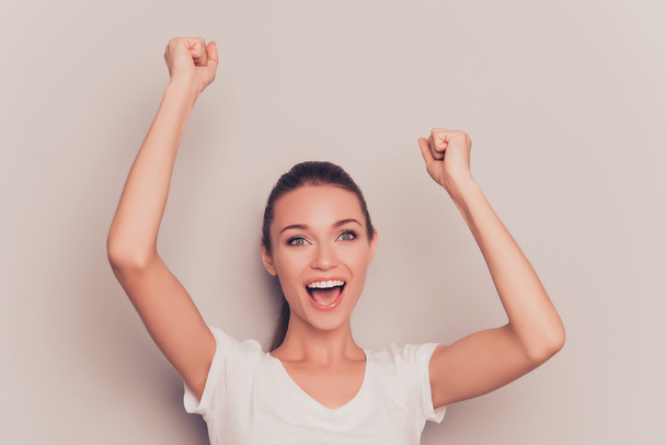 Yes! Cheerful happy woman celebrating her victory - Фото, изображение