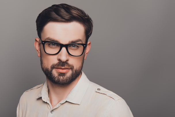 Portrait of smart young handsome bearded man in glasses - Fotoğraf, Görsel