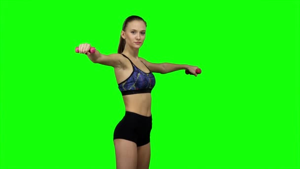 Woman fitness instructor doing exercises. Green screen - Felvétel, videó