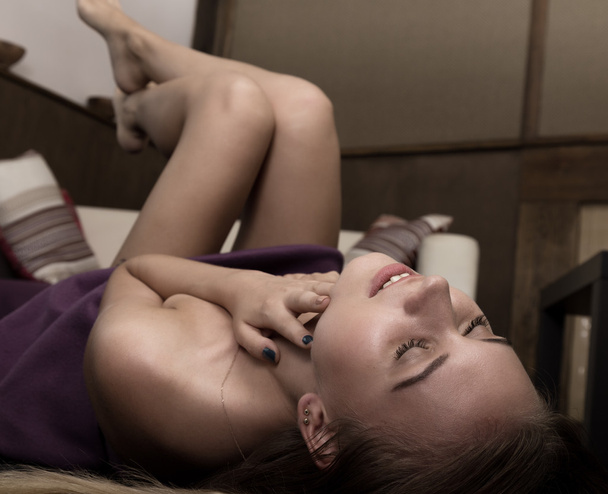 sexy glamour pose girl lying on floor and flirts. she makes beckoning gestures - Φωτογραφία, εικόνα