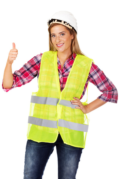 Young smile female builder in vest - Fotografie, Obrázek