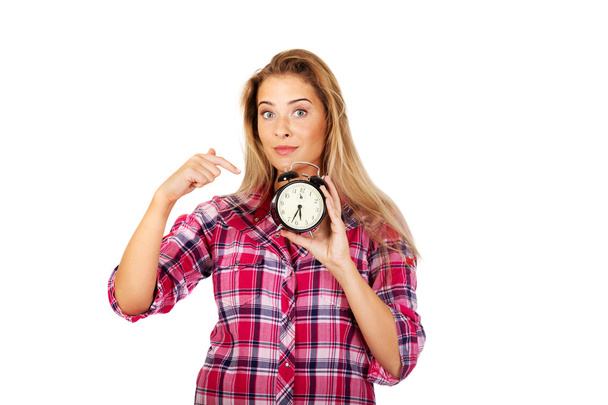 Young woman holding alarm clock - Foto, afbeelding