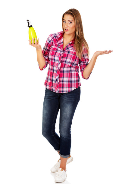 Young woman holding a watering spray bottle - Foto, Imagem