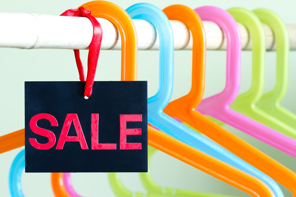 Sale of clothing concept with empty hangers - Foto, imagen