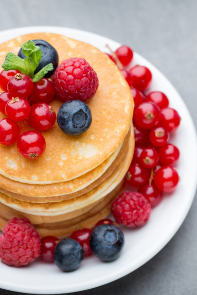 Stack of pancakes with blueberry and fresh berry. - Fotó, kép