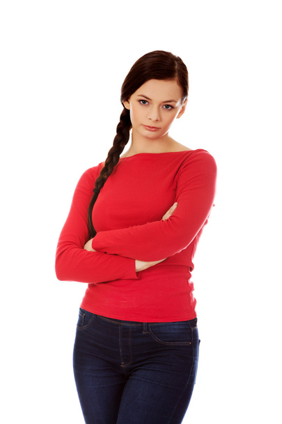 Annoyed young woman with arms crossed - Фото, зображення