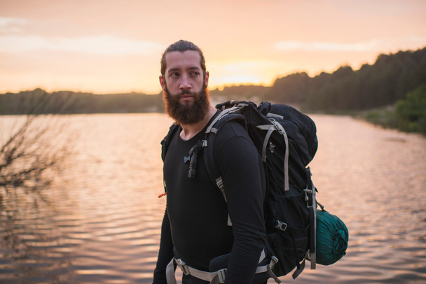 Backpacker at dune lake  - Photo, Image