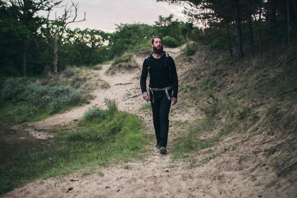 Hiker with beard in nature - 写真・画像
