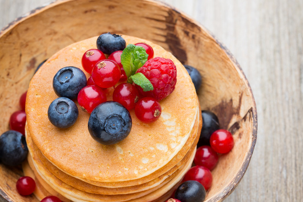 Stack of pancakes with blueberry and fresh berry. - Fotografie, Obrázek