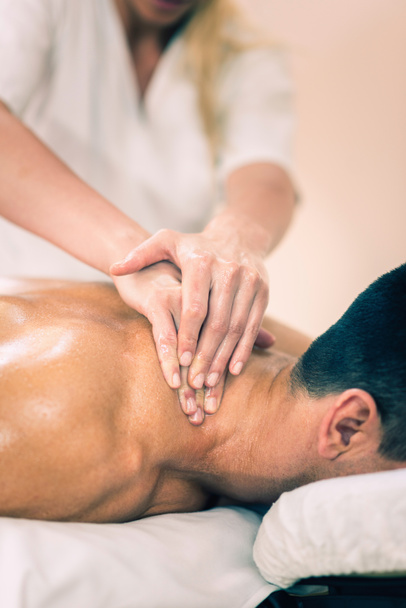 Physical therapist doing massage of neck - Photo, Image