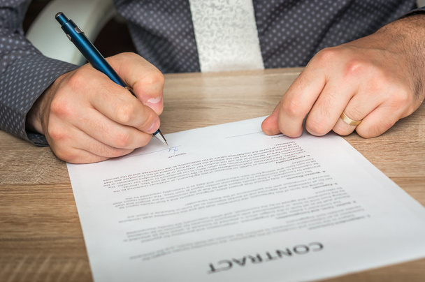 Businessman is signing a contract - Photo, Image